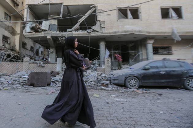 October 3, 2026, Gaza City, Gaza Strip, Palestinian Territory: Palestinians inspect the destruction after Israeli aircraft targeted a residential apartment in the Al-Rimal neighborhood of western Gaza City early in the morning. According to local sources, five Palestinians were killed, including four women. Among those killed were a Christian mother and her daughter. Gaza City Palestinian Territory - ZUMAz119 20261003_zip_z119_026 Copyright: xSalahxHashemx