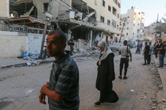 October 3, 2026, Gaza City, Gaza Strip, Palestinian Territory: Palestinians inspect the destruction after Israeli aircraft targeted a residential apartment in the Al-Rimal neighborhood of western Gaza City early in the morning. According to local sources, five Palestinians were killed, including four women. Among those killed were a Christian mother and her daughter. Gaza City Palestinian Territory - ZUMAz119 20261003_zip_z119_027 Copyright: xSalahxHashemx