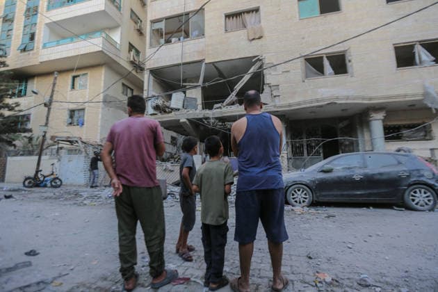 October 3, 2026, Gaza City, Gaza Strip, Palestinian Territory: Palestinians inspect the destruction after Israeli aircraft targeted a residential apartment in the Al-Rimal neighborhood of western Gaza City early in the morning. According to local sources, five Palestinians were killed, including four women. Among those killed were a Christian mother and her daughter. Gaza City Palestinian Territory - ZUMAz119 20261003_zip_z119_021 Copyright: xSalahxHashemx
