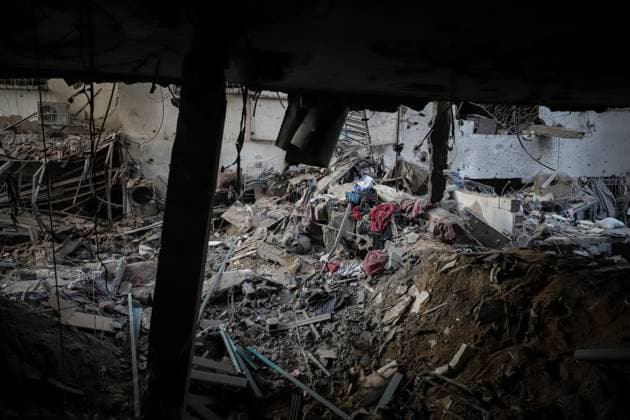 October 3, 2026, Gaza, Palestine, State of: GAZA Gaza, GAZA STRIP, OCTOBER 3, 2026: Palestinians and rescue workers search through the rubble following an Israeli airstrike on a residential building in the Rimal neighborhood of western Gaza City early Saturday. At least five Palestinians were killed and others wounded in the strike, according to Gaza health and civil defense officials. Rescue crews continued searching the damaged building for missing people following the attack. There was no immediate comment from the Israeli military. Gaza Palestine, State of - ZUMAq101 20261003_zna_q101_001 Copyright: xMohammedxMxSkaikx