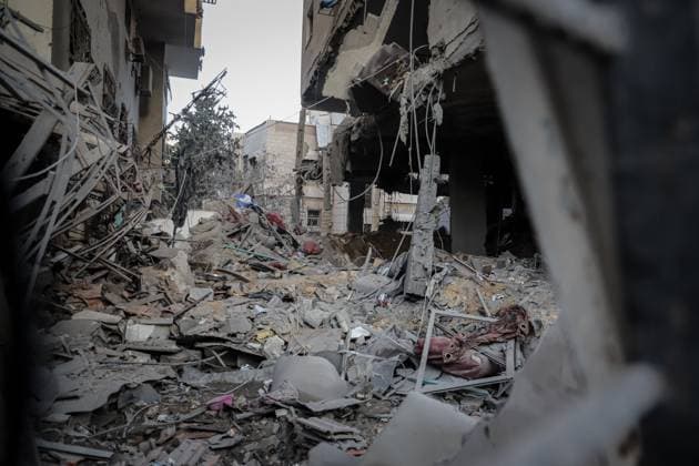 October 3, 2026, Gaza, Palestine, State of: GAZA Gaza, GAZA STRIP, OCTOBER 3, 2026: Palestinians and rescue workers search through the rubble following an Israeli airstrike on a residential building in the Rimal neighborhood of western Gaza City early Saturday. At least five Palestinians were killed and others wounded in the strike, according to Gaza health and civil defense officials. Rescue crews continued searching the damaged building for missing people following the attack. There was no immediate comment from the Israeli military. Gaza Palestine, State of - ZUMAq101 20261003_zna_q101_002 Copyright: xMohammedxMxSkaikx