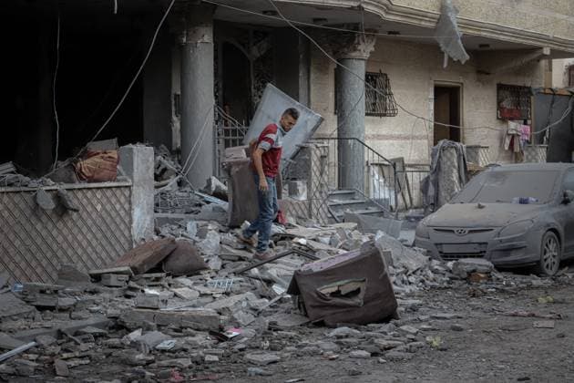October 3, 2026, Gaza, Palestine, State of: GAZA Gaza, GAZA STRIP, OCTOBER 3, 2026: Palestinians and rescue workers search through the rubble following an Israeli airstrike on a residential building in the Rimal neighborhood of western Gaza City early Saturday. At least five Palestinians were killed and others wounded in the strike, according to Gaza health and civil defense officials. Rescue crews continued searching the damaged building for missing people following the attack. There was no immediate comment from the Israeli military. Gaza Palestine, State of - ZUMAq101 20261003_zna_q101_003 Copyright: xMohammedxMxSkaikx