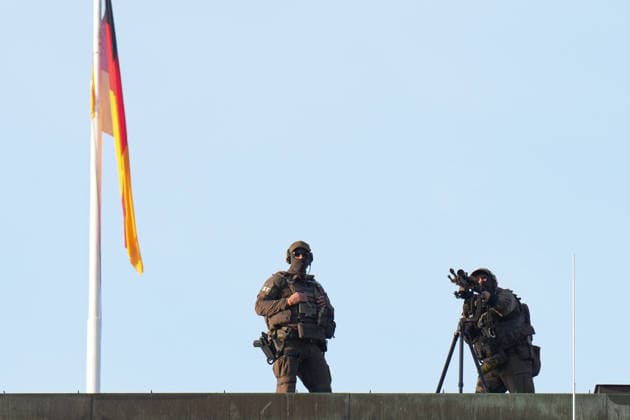 German Unity Day Celebrations in Bremen: Snipers under a German flag on the roof during the 2026 German Unity Day celebrations in Bremen, Bremen, October 3, 2026, Bremen, Germany