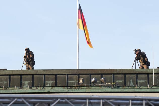 German Unity Day Celebrations in Bremen: Snipers under a German flag on the roof during the 2026 German Unity Day celebrations in Bremen, Bremen, October 3, 2026, Bremen, Germany