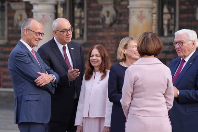 German Unity Day celebrations in Bremen: Federal Chancellor Friedrich Merz (CDU) in conversation with Andreas Bovenschulte in front of City Hall upon his arrival for the 2026 German Unity Day celebrations in Bremen, Bremen, October 3, 2026, Bremen, Germany