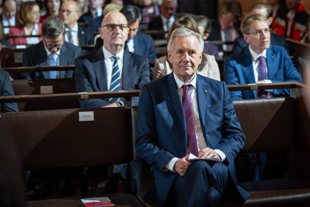 Ecumenical service at St. Petri Cathedral: Christian Wulff, former Federal President, in the front row; behind him, from left, Dietmar Woidke, Minister-President of Brandenburg, and Daniel Günther, Minister-President of Schleswig-Holstein. Official central celebrations for German Unity Day 2026 in Bremen, Bremen, Germany, downtown