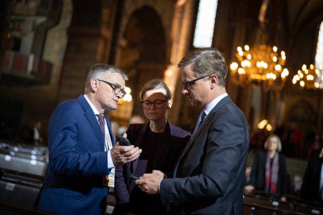 Ecumenical service at St. Petri Cathedral: Carsten Linnemann, Federal Minister of Health, in conversation with government spokesperson Stefan Kornelius and Mira Schlüter, Carsten Linnemann’s chief of staff. Official central celebrations for German Unity Day 2026 in Bremen, Bremen, Germany, downtown