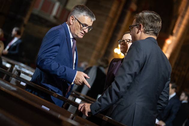 Ecumenical service at St. Petri Cathedral: Carsten Linnemann, Federal Minister of Health, in conversation with government spokesperson Stefan Kornelius and Mira Schlüter, Carsten Linnemann’s chief of staff. Official central celebrations for German Unity Day 2026 in Bremen, Bremen, Germany, downtown