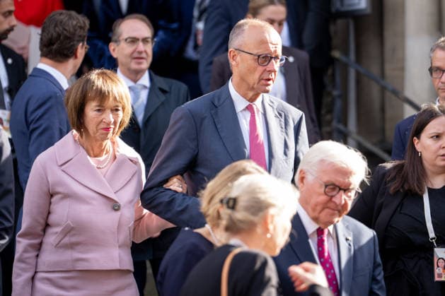 Celebrations for German Unity Day 2026 in Bremen: Federal Chancellor Friedrich Merz (CDU), along with his wife Charlotte Merz and Federal President Frank Walter Steinmeier, are seen in the foreground as they exit St. Petri Cathedral after the ecumenical service marking German Unity Day 2026 in Bremen, Bremen, October 3, 2026, Bremen, Bremen, Germany