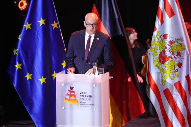 German Unity Day Ceremony in Bremen: Andreas Bovenschulte, President of the Bundesrat and Mayor of Bremen, delivering his speech at the German Unity Day ceremony at *Die Glocke*, Bremen, October 3, 2026, Bremen, Germany