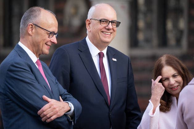 Celebrations for German Unity Day 2026 in Bremen: Federal Chancellor Friedrich Merz (CDU), together with Andreas Bovenschulte, President of the Bundesrat, and his wife Kerstin Krueger, professor of integrated plant protection, at the Marktplatz in Bremen for the celebrations marking German Unity Day 2026, Bremen, October 3, 2026, Bremen, Germany