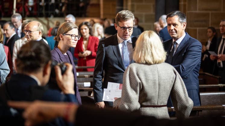 Ecumenical service at St. Petri Cathedral: Mira Schlüter, Office Manager; Carsten Linnemann, Federal Minister of Health; and Olaf Lies, Minister-President of Lower Saxony, from left toward the camera. Official central celebrations for German Unity Day 2026 in Bremen, Bremen, Germany, downtown
