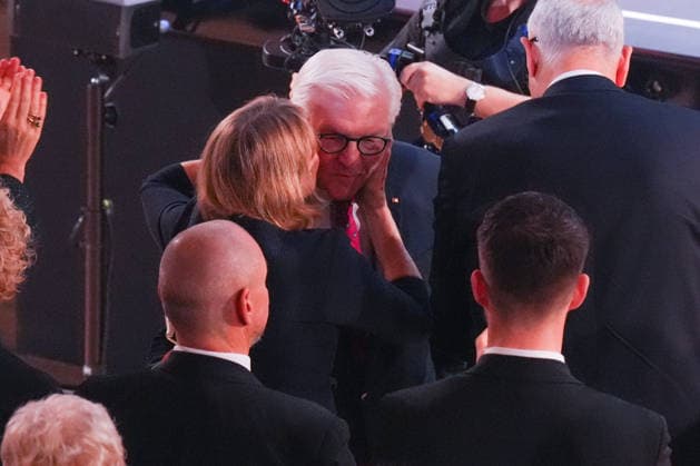 German Unity Day Ceremony in Bremen: Elke Buedenbender kisses her husband, Federal President Frank Walter Steinmeier, after his impressive and thought-provoking speech at the German Unity Day ceremony at the Glocke in Bremen, October 3, 2026, Bremen, Germany