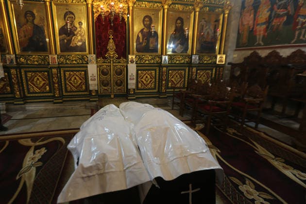October 3, 2026, Gaza City, Gaza Strip, Palestinian Territory: Palestinian Christians gather to bid farewell and pray beside the bodies of Maysaa Abu Daoud and her daughter, Mary Abu Daoud, who were killed in an Israeli airstrike that targeted a residential apartment in western Gaza City. Funeral prayers are held at St. Porphyrios Church in the Zeitoun neighborhood of southeastern Gaza City. Gaza City Palestinian Territory - ZUMAz119 20261003_zip_z119_032 Copyright: xSalahxHashemx
