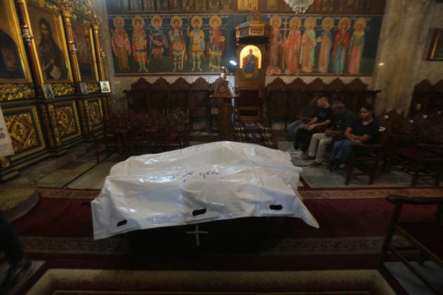October 3, 2026, Gaza City, Gaza Strip, Palestinian Territory: Palestinian Christians gather to bid farewell and pray beside the bodies of Maysaa Abu Daoud and her daughter, Mary Abu Daoud, who were killed in an Israeli airstrike that targeted a residential apartment in western Gaza City. Funeral prayers are held at St. Porphyrios Church in the Zeitoun neighborhood of southeastern Gaza City. Gaza City Palestinian Territory - ZUMAz119 20261003_zip_z119_033 Copyright: xSalahxHashemx