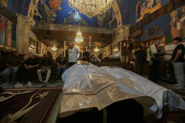 October 3, 2026, Gaza City, Gaza Strip, Palestinian Territory: Palestinian Christians gather to bid farewell and pray beside the bodies of Maysaa Abu Daoud and her daughter, Mary Abu Daoud, who were killed in an Israeli airstrike that targeted a residential apartment in western Gaza City. Funeral prayers are held at St. Porphyrios Church in the Zeitoun neighborhood of southeastern Gaza City. Gaza City Palestinian Territory - ZUMAz119 20261003_zip_z119_038 Copyright: xSalahxHashemx