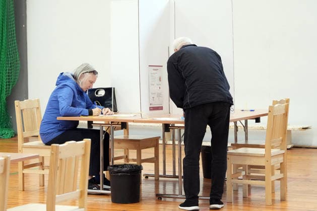 (261003) -- RIGA, Oct. 3, 2026 -- Voters fill out their ballots at a polling station in Riga, Latvia, Oct. 3, 2026. Voting in the Latvian parliamentary election began on Saturday morning, with 1,428 candidates vying for 100 seats in the 15th Saeima, Latvia s parliament. (Photo by Xinhua) LATVIA-RIGA-PARLIAMENTARY ELECTION EdijsxPalens 
