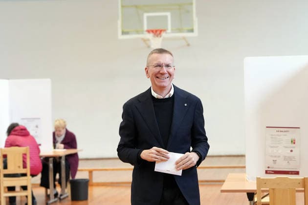 (261003) -- RIGA, Oct. 3, 2026 -- Latvian President Edgars Rinkevics prepares to cast his ballot at a polling station in Riga, Latvia, Oct. 3, 2026. Voting in the Latvian parliamentary election began on Saturday morning, with 1,428 candidates vying for 100 seats in the 15th Saeima, Latvia s parliament. (Photo by Xinhua) LATVIA-RIGA-PARLIAMENTARY ELECTION EdijsxPalens 