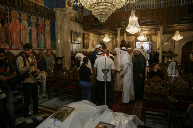 October 3, 2026, Gaza City, Gaza Strip, Palestinian Territory: Palestinian Christians gather to bid farewell and pray beside the bodies of Maysaa Abu Daoud and her daughter, Mary Abu Daoud, who were killed in an Israeli airstrike that targeted a residential apartment in western Gaza City. Funeral prayers are held at St. Porphyrios Church in the Zeitoun neighborhood of southeastern Gaza City. Gaza City Palestinian Territory - ZUMAz119 20261003_zip_z119_045 Copyright: xSalahxHashemx