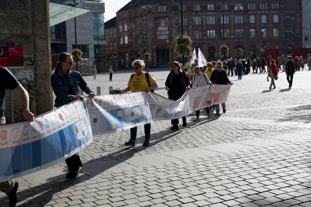 October 3, 2026 Press Event: Es brennt Initiative Human Chain in Dortmund, Hansaplatz Marching with the banner to Westenhellweg, Dortmund; Hansaplatz and Westenhellweg, North Rhine-Westphalia, Germany