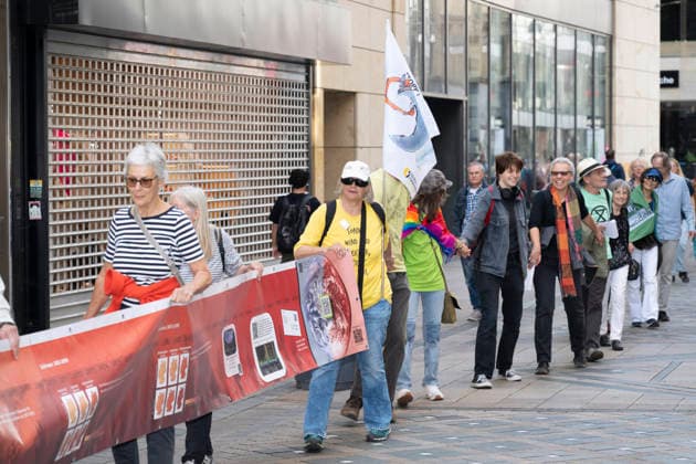 October 3, 2026 Press event: Es brennt initiative—human chain in Dortmund, Hansaplatz; participants on Westenhellweg, Dortmund; Hansaplatz and Westenhellweg, North Rhine-Westphalia, Germany