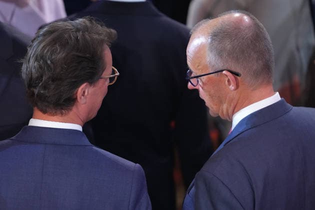 German Unity Day Ceremony in Bremen: Chancellor Friedrich Merz and North Rhine-Westphalia Minister-President Hendrik Wuest in conversation after the German Unity Day ceremony at the Glocke, Bremen, October 3, 2026, Bremen, Germany