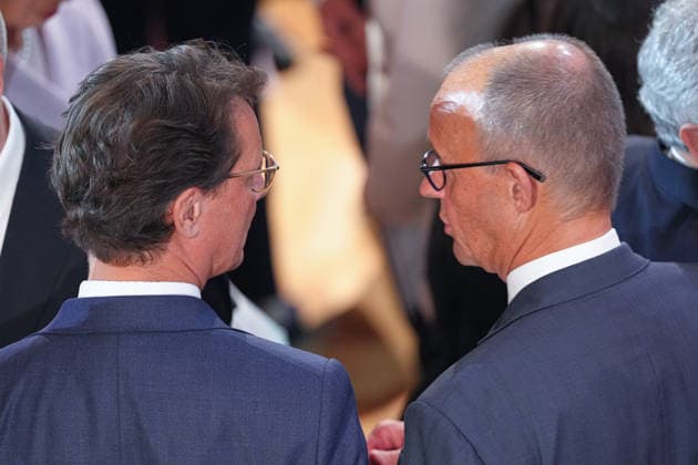German Unity Day Ceremony in Bremen: Chancellor Friedrich Merz and North Rhine-Westphalia Minister-President Hendrik Wuest in conversation after the German Unity Day ceremony at the Glocke, Bremen, October 3, 2026, Bremen, Germany