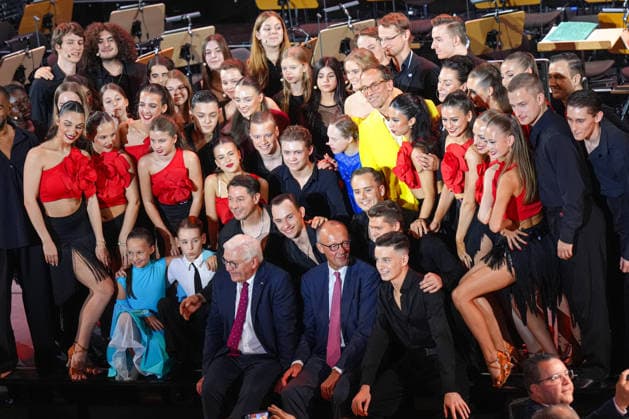 German Unity Day Ceremony in Bremen: Group photo with Chancellor Friedrich Merz and Federal President Frank Walter Steinmeier; the artists performing at the German Unity Day ceremony pose for a photo with the two heads of state after their performance, Bremen, October 3, 2026, Bremen, Bremen, Germany