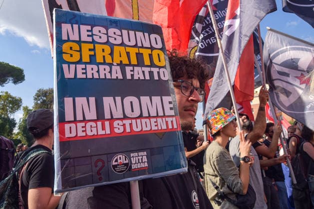 October 3, 2026, Rome, Rome, Italy: A protester holds a sign against the policies of the Meloni government during the Potere al Popolo demonstration at Piazza Bocca della Verità in Rome on October 3, 2026. Rome Italy - ZUMAn299 20261003_zip_n299_022 Copyright: xVincenzoxNuzzolesex