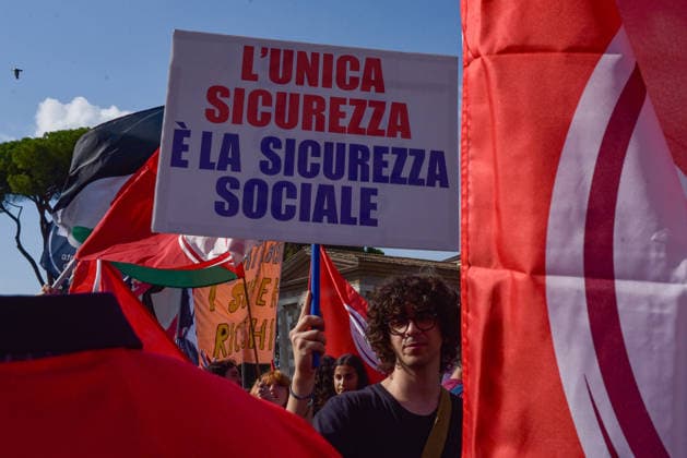 October 3, 2026, Rome, Rome, Italy: A protester holds a sign against the policies of the Meloni government during the Potere al Popolo demonstration at Piazza Bocca della Verità in Rome on October 3, 2026. Rome Italy - ZUMAn299 20261003_zip_n299_019 Copyright: xVincenzoxNuzzolesex