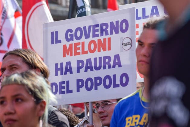 October 3, 2026, Rome, Rome, Italy: A protester holds a sign against the policies of the Meloni government during the Potere al Popolo demonstration at Piazza Bocca della Verità in Rome on October 3, 2026. Rome Italy - ZUMAn299 20261003_zip_n299_026 Copyright: xVincenzoxNuzzolesex