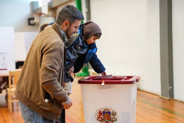 October 3, 2026, Riga, LATVIA: Man casts his vote at a polling station during the parliamentary elections in Riga, Latvia, Oct. 3, 2026. Riga LATVIA - ZUMAp305 20261003_zip_p305_010 Copyright: xEdijsxPalensx