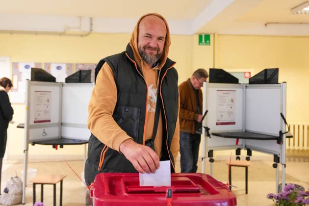 October 3, 2026, Riga, LATVIA: Man casts his vote at a polling station during the parliamentary elections in Riga, Latvia, Oct. 3, 2026. Riga LATVIA - ZUMAp305 20261003_zip_p305_001 Copyright: xEdijsxPalensx