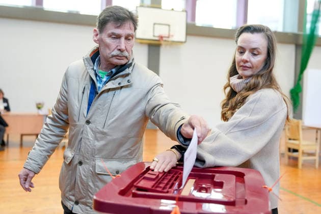 October 3, 2026, Riga, LATVIA: Man casts his vote at a polling station during the parliamentary elections in Riga, Latvia, Oct. 3, 2026. Riga LATVIA - ZUMAp305 20261003_zip_p305_009 Copyright: xEdijsxPalensx