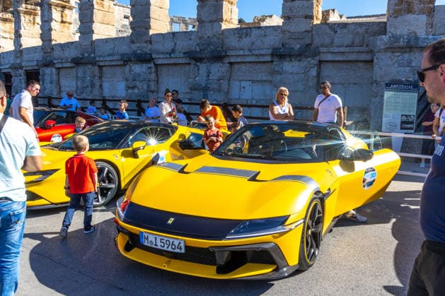 Ferrari Tour stops in Pula Luxury Ferrari sports cars taking part in a Ferrari Tour organized by Ineco Auto, are seen in front of the Roman Arena in Pula, Croatia, on October 3, 2026. While the drivers visit the ancient amphitheatre, local residents gather to watch and admire the vehicles.  SreckoxNiketic PIXSELL