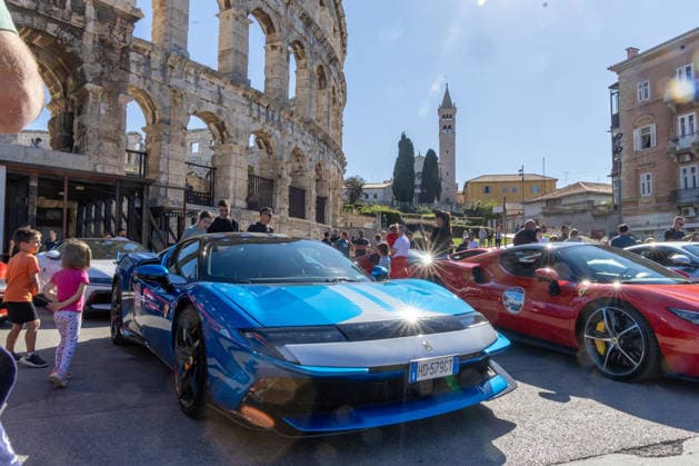 Ferrari Tour stops in Pula Luxury Ferrari sports cars taking part in a Ferrari Tour organized by Ineco Auto, are seen in front of the Roman Arena in Pula, Croatia, on October 3, 2026. While the drivers visit the ancient amphitheatre, local residents gather to watch and admire the vehicles.  SreckoxNiketic PIXSELL