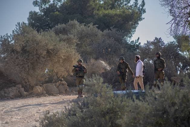 Israeli Forces Arrested Palestinian Farmers Attempting To Harvest Olives Near Beita JABAL KAMAS, BEITA, PALESTINE OCTOBER 3, 2026: Israeli forces arrested seven Palestinian residents who were attempting to harvest their land in Jabal Kamas, near Beita. According to the provided information, nearly 20 Israeli settlers from the Mevaser Hashalom outpost, also known as Herald of Peace, attacked the farmers as they began working, while Israeli soldiers opened live fire. The military later arrested seven Palestinian residents and declared the area a closed military zone. The incident occurred as Palestinian farmers attempted to access and harvest their agricultural land near Beita. Nablus PS Copyright: x xRomanxLevinx xJNAxPressx