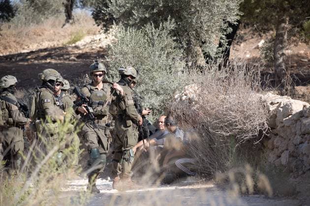 Israeli Forces Arrested Palestinian Farmers Attempting To Harvest Olives Near Beita JABAL KAMAS, BEITA, PALESTINE OCTOBER 3, 2026: Israeli forces arrested seven Palestinian residents who were attempting to harvest their land in Jabal Kamas, near Beita. According to the provided information, nearly 20 Israeli settlers from the Mevaser Hashalom outpost, also known as Herald of Peace, attacked the farmers as they began working, while Israeli soldiers opened live fire. The military later arrested seven Palestinian residents and declared the area a closed military zone. The incident occurred as Palestinian farmers attempted to access and harvest their agricultural land near Beita. Nablus PS Copyright: x xRomanxLevinx xJNAxPressx