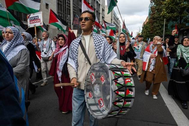 October 3, 2026, Berlin, Germany: BERLIN, GERMANY †OCTOBER 3, 2026: Thousands of people took part in a peace demonstration in central Berlin on German Unity Day. A coalition of peace initiatives, trade unions, and political and civil-society groups organized the protest. The demonstrators focused on military rearmament, the possible reintroduction of conscription, and Germanyâ€⠢s military policy. The march began at the Brandenburg Gate and continued through the government district before concluding with a rally. The demonstration brought together participants expressing opposition to Germanyâ€⠢s current and proposed military policies on a national public holiday. Berlin Germany - ZUMAq101 20261003_zna_q101_089 Copyright: xJessxFlomx