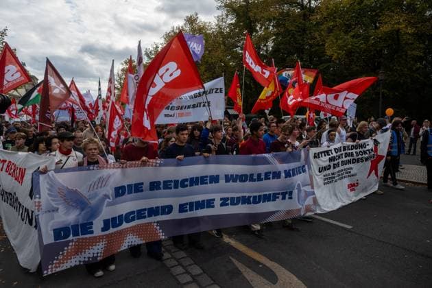 October 3, 2026, Berlin, Germany: BERLIN, GERMANY †OCTOBER 3, 2026: Thousands of people took part in a peace demonstration in central Berlin on German Unity Day. A coalition of peace initiatives, trade unions, and political and civil-society groups organized the protest. The demonstrators focused on military rearmament, the possible reintroduction of conscription, and Germanyâ€⠢s military policy. The march began at the Brandenburg Gate and continued through the government district before concluding with a rally. The demonstration brought together participants expressing opposition to Germanyâ€⠢s current and proposed military policies on a national public holiday. Berlin Germany - ZUMAq101 20261003_zna_q101_108 Copyright: xJessxFlomx