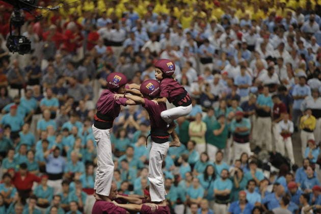 Human tower groups perform in the 30th Concurs de Castells competition in Tarragona TARRAGONA, SPAIN - OCTOBER 3: Members of human tower groups (colles) build intricate human towers (castells) during the competition section of the 30th Concurs de Castells at the Tarraco Arena Placa in Tarragona, Spain on October 3, 2026. The biennial event, recognized as UNESCO Intangible Cultural Heritage, gathers top teams from across Catalonia to construct towering multi-tiered human structures. Senhan Bolelli Anadolu Tarragona Spain. Editorial use only. Please get in touch for any other usage.  Copyright: x2026xAnadoluxSenhanxBolellix