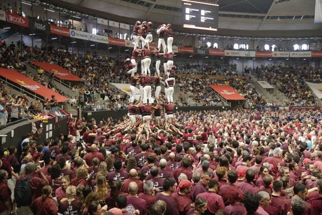 Human tower groups perform in the 30th Concurs de Castells competition in Tarragona TARRAGONA, SPAIN - OCTOBER 3: Members of human tower groups (colles) build intricate human towers (castells) during the competition section of the 30th Concurs de Castells at the Tarraco Arena Placa in Tarragona, Spain on October 3, 2026. The biennial event, recognized as UNESCO Intangible Cultural Heritage, gathers top teams from across Catalonia to construct towering multi-tiered human structures. Senhan Bolelli Anadolu Tarragona Spain. Editorial use only. Please get in touch for any other usage.  Copyright: x2026xAnadoluxSenhanxBolellix