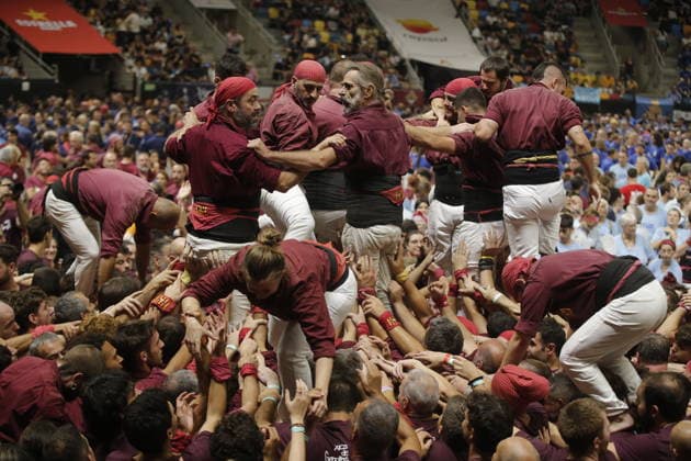 Human tower groups perform in the 30th Concurs de Castells competition in Tarragona TARRAGONA, SPAIN - OCTOBER 3: Members of human tower groups (colles) build intricate human towers (castells) during the competition section of the 30th Concurs de Castells at the Tarraco Arena Placa in Tarragona, Spain on October 3, 2026. The biennial event, recognized as UNESCO Intangible Cultural Heritage, gathers top teams from across Catalonia to construct towering multi-tiered human structures. Senhan Bolelli Anadolu Tarragona Spain. Editorial use only. Please get in touch for any other usage.  Copyright: x2026xAnadoluxSenhanxBolellix