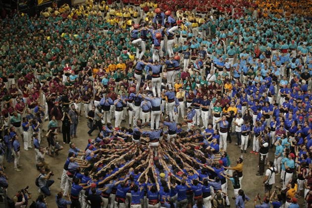 Human tower groups perform in the 30th Concurs de Castells competition in Tarragona TARRAGONA, SPAIN - OCTOBER 3: Members of human tower groups (colles) build intricate human towers (castells) during the competition section of the 30th Concurs de Castells at the Tarraco Arena Placa in Tarragona, Spain on October 3, 2026. The biennial event, recognized as UNESCO Intangible Cultural Heritage, gathers top teams from across Catalonia to construct towering multi-tiered human structures. Senhan Bolelli Anadolu Tarragona Spain. Editorial use only. Please get in touch for any other usage.  Copyright: x2026xAnadoluxSenhanxBolellix