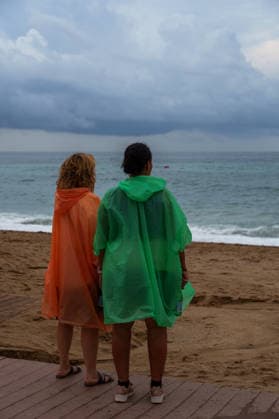 Red alert for extreme weather in Barcelona, Spain. Two women are wearing raincoats during red alert for extreme weather in Promenade, Barcelona, Spain, on October 3, 2026. Barcelona Promenade Barcelona Spain