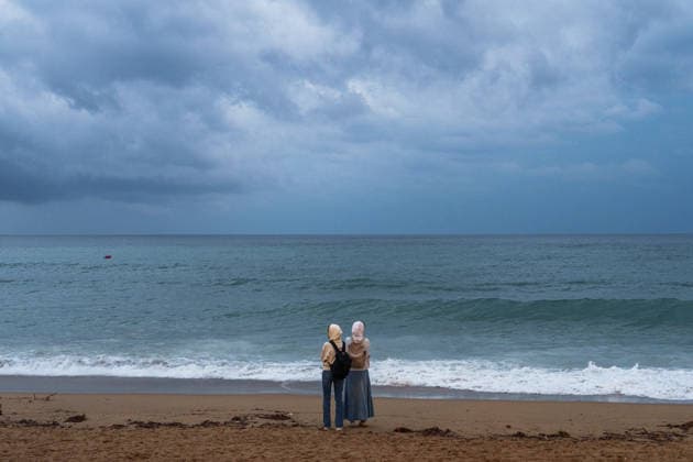 Red alert for extreme weather in Barcelona, Spain. Two women look at the weather and the sea during ES-Alert for extreme weather in Promenade, Barcelona, Spain, on October 3, 2026. Barcelona Promenade Barcelona Spain
