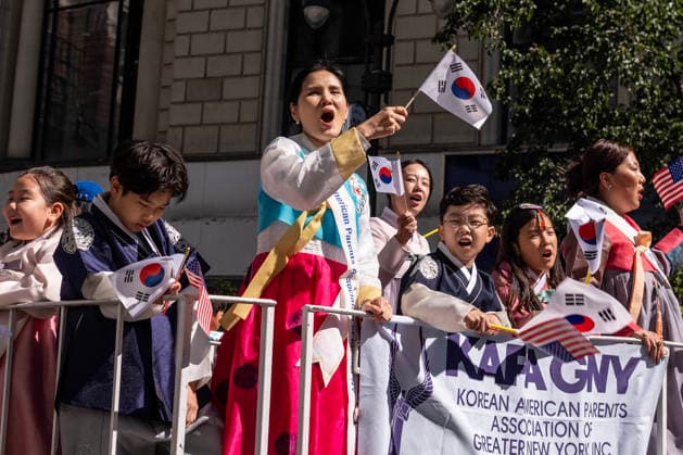 October 3, 2026, New York, New York, USA: A participant at the 2026 NYC Korean Parade waves her Korean flag on top of a float. New York USA - ZUMAh214 20261003_znp_h214_031 Copyright: xSDxHerzogx