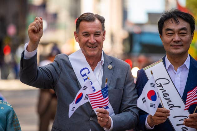 October 3, 2026, New York, New York, USA: US congressman TOM SUOZZI poses for a photo with a fellow grand mashal while marching in the 2026 NYC Korean parade. New York USA - ZUMAh214 20261003_znp_h214_035 Copyright: xSDxHerzogx