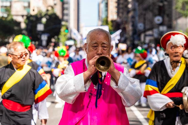 October 3, 2026, New York, New York, USA: A participant at the 2026 NYC Korean Parade plays a horn while marching down Sixth Avenue. New York USA - ZUMAh214 20261003_znp_h214_052 Copyright: xSDxHerzogx