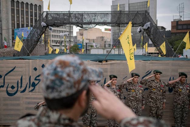 Opening Ceremony Of Second City-Square Military Training Camp Iranian schoolboys wearing Iranian Army military uniforms salute during the opening ceremony of the second city-square military training camp for self-sacrificing forces in downtown Tehran, Iran, on October 3, 2026. The camp was established by the Basij paramilitary force, with personnel from the Islamic Republic of Iran Army responsible for training the volunteers. Tehran Tehran Iran  Copyright: xMortezaxNikoubazlx originalFilename: nikoubazl-openingc261003_npJ8C.jpg